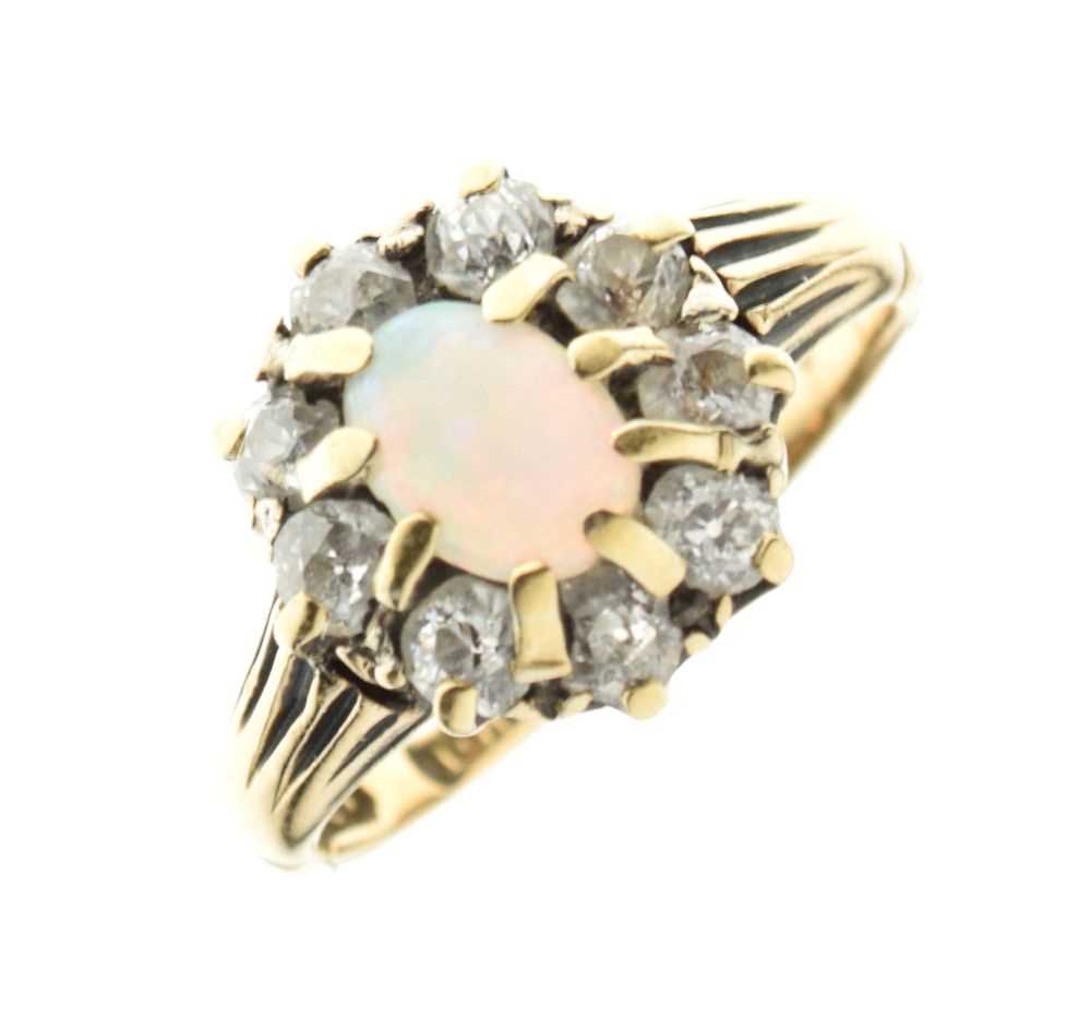 Lot 1 - Yellow metal (18ct) ring set opal and diamonds
