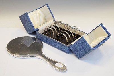 Lot 193 - Cased pair of George VI silver toast racks together with a George V silver-backed mirror