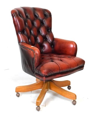 Lot 756 - Button-back office swivel chair, with red leatherette upholstery