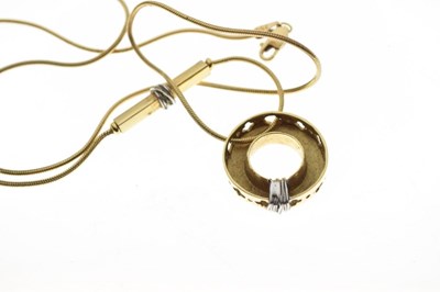 Lot 39 - Yellow metal (750) circular pendant on a fine snake chain, 10.8g gross approx
