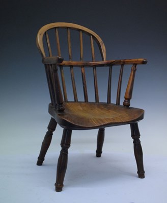 Lot 447 - Child's yew and elm low hoop back Windsor style chair