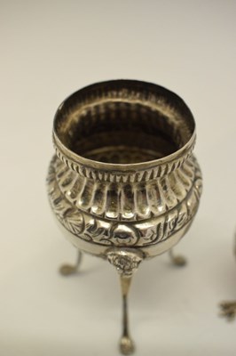 Lot 116 - Late 19th Century Continental cast silver egg cup together with a white-metal pedestal salt