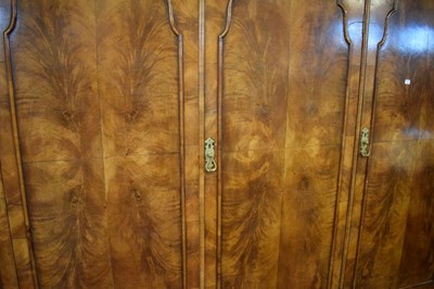 Lot 521 - Queen Anne-Style walnut three-section domed wardrobe