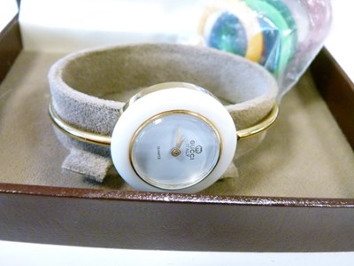 Lot 71 - Gucci lady's bracelet watch, with ten separate interchangeable bezels