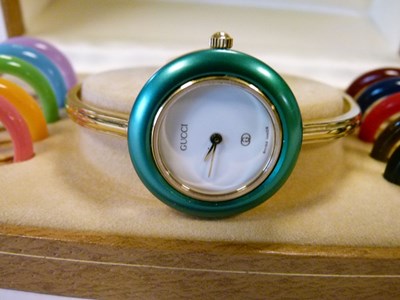 Lot 70 - Gucci lady's bracelet watch, with ten separate interchangeable bezels
