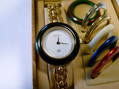 Lot 69 - Gucci lady's bracelet watch, with six separate interchangeable bezels