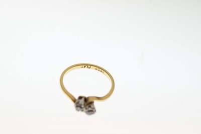 Lot 9 - Two stone diamond crossover ring