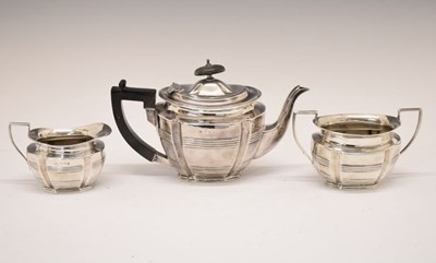 Lot 157 - Edward VII silver three piece tea set of oval form