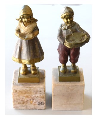 Lot 244 - Pair of Dutch-style gilt figures on marble bases