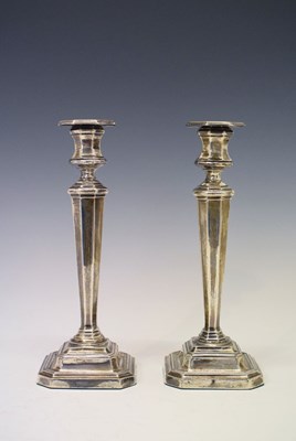 Lot 99 - Pair of George V silver candlesticks