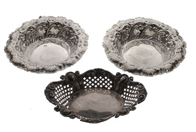 Lot 175 - Pair of Edward VII silver circular bonbon dishes and another oval
