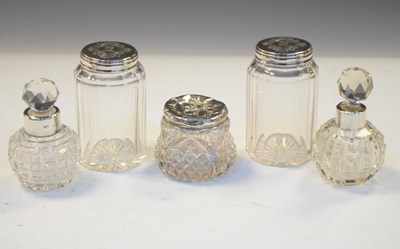Lot 182 - Two silver mounted scent bottles together with three silver-topped dressing table jars