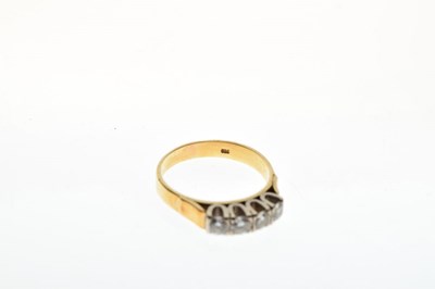 Lot 6 - Yellow metal, four-stone ring