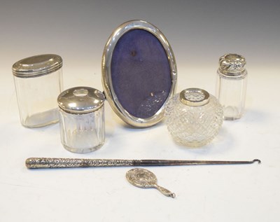 Lot 204 - Silver mounted oval easel picture frame, four dressing table jars, etc