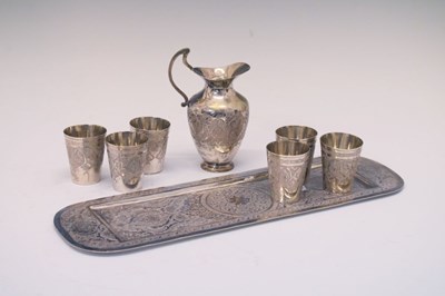 Lot 122 - Persian (possibly Isfahan) rectangular white metal tray, cups, and jug