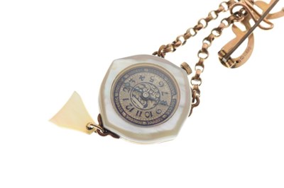 Lot 120 - Mother-of-pearl pendant watch on 9ct brooch