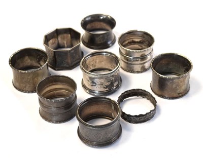 Lot 162 - Nine silver napkin rings