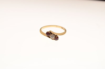 Lot 16 - Ruby and diamond three-stone crossover ring