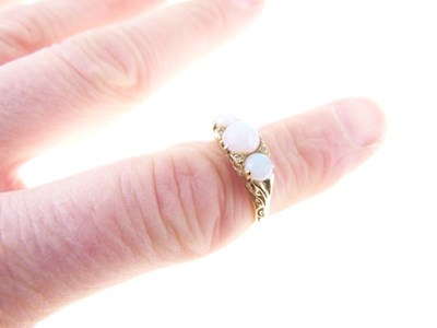 Lot 28 - Three-stone opal 18ct gold ring