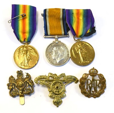 Lot 315 - Three First World War Medals and cap badges