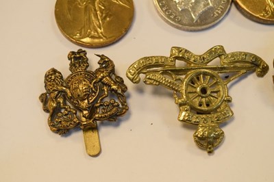 Lot 315 - Three First World War Medals and cap badges