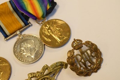 Lot 315 - Three First World War Medals and cap badges