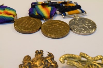 Lot 315 - Three First World War Medals and cap badges