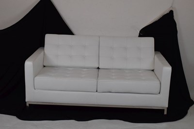 Lot 585 - White leather two-seater settee and footstool