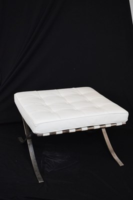 Lot 585 - White leather two-seater settee and footstool