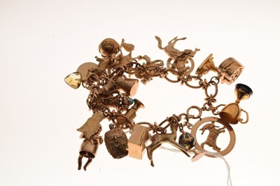 Lot 38 - 9ct gold charm bracelet, attached various charms
