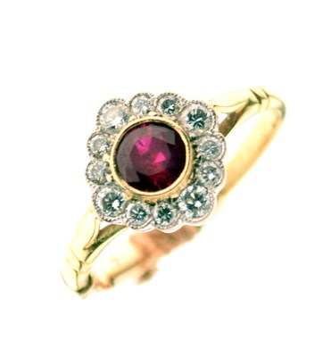 Lot 13 - Ruby and diamond 18ct gold cluster ring