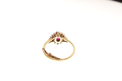 Lot 13 - Ruby and diamond 18ct gold cluster ring