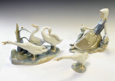 Lot 391 - Lladro lady figure, group of three geese, and single