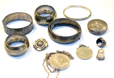 Lot 211 - Assorted silver - bangles, napkin rings, compact, pendants, thimble etc